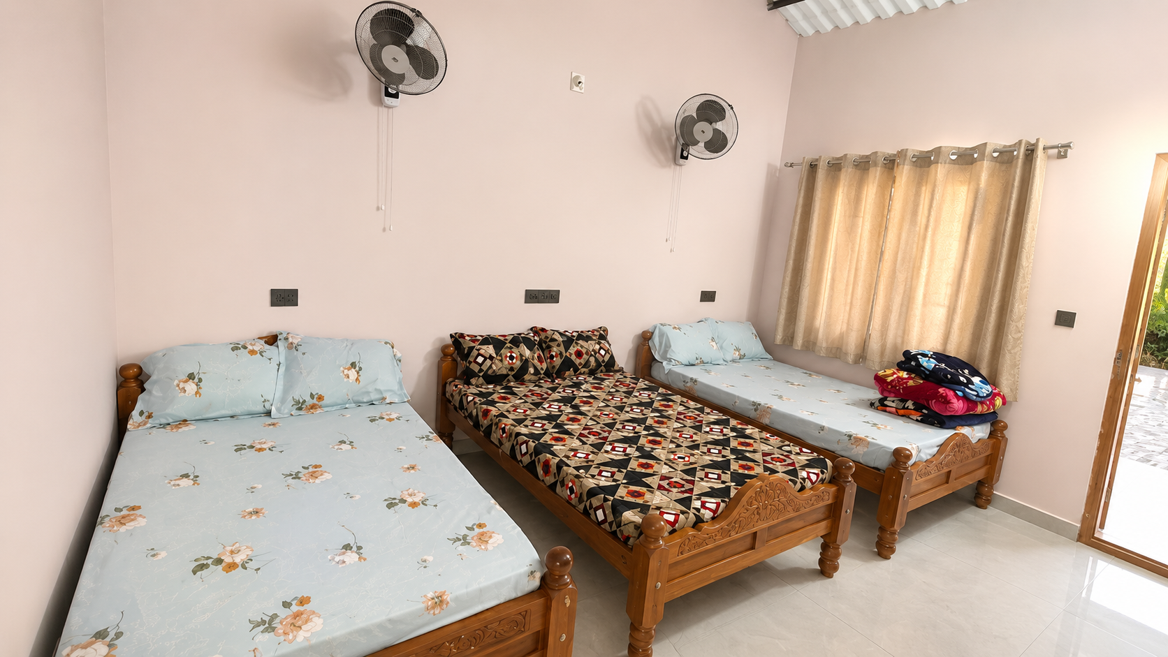 Bedroom at Mungaru Woods Homestay with three beds